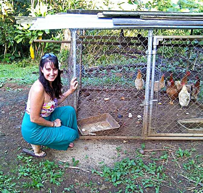 Jenn Marr outdoors beside her chickens on the North Shore